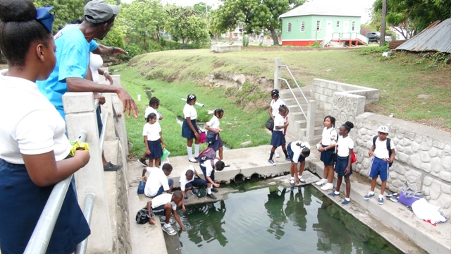 Students of Nevis Academy touring the Bath hot springs on April 18, 2016, as part of the Ministry of Tourism’s Exposition Nevis, tourism awareness activities. They are led by tour guide Lemuel Pemberton